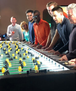 foosball match between coworkers in Dubai